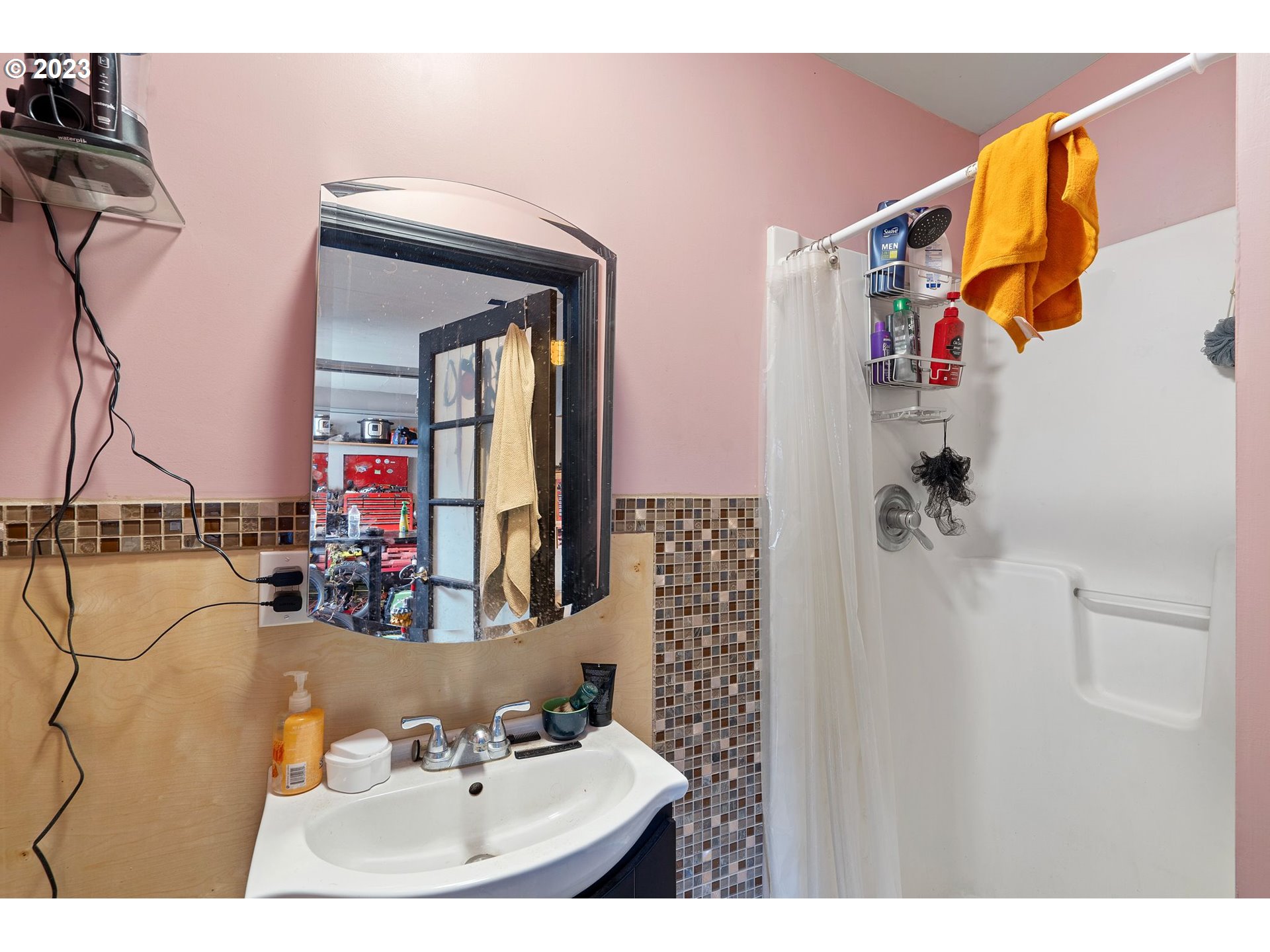 5119 Southeast 68th Avenue Portland, OR 97206 - Photo 21 of 43 a bathroom with a sink and a mirror