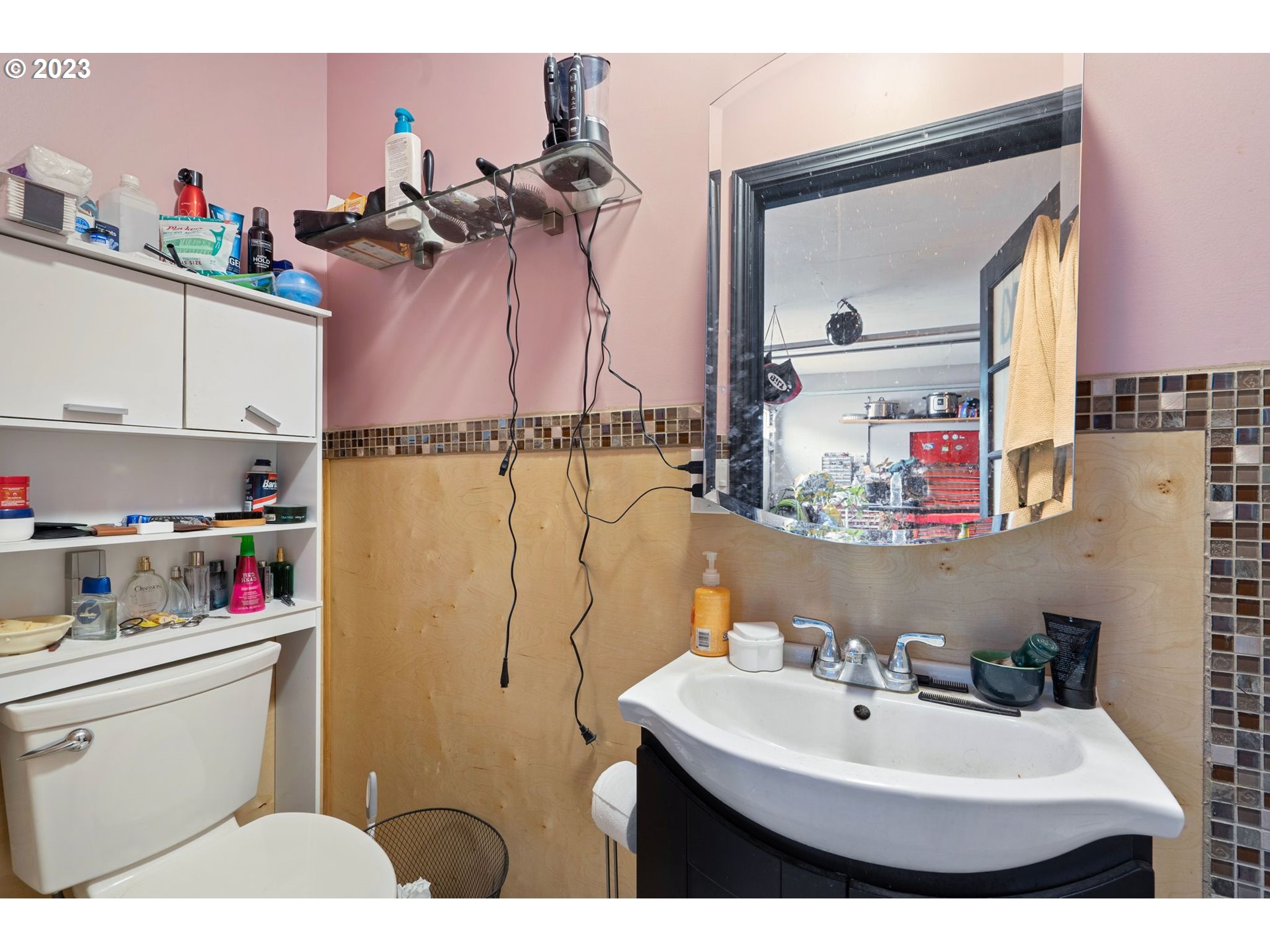 5119 Southeast 68th Avenue Portland, OR 97206 - Photo 22 of 43 a bathroom with a sink mirror and vanity