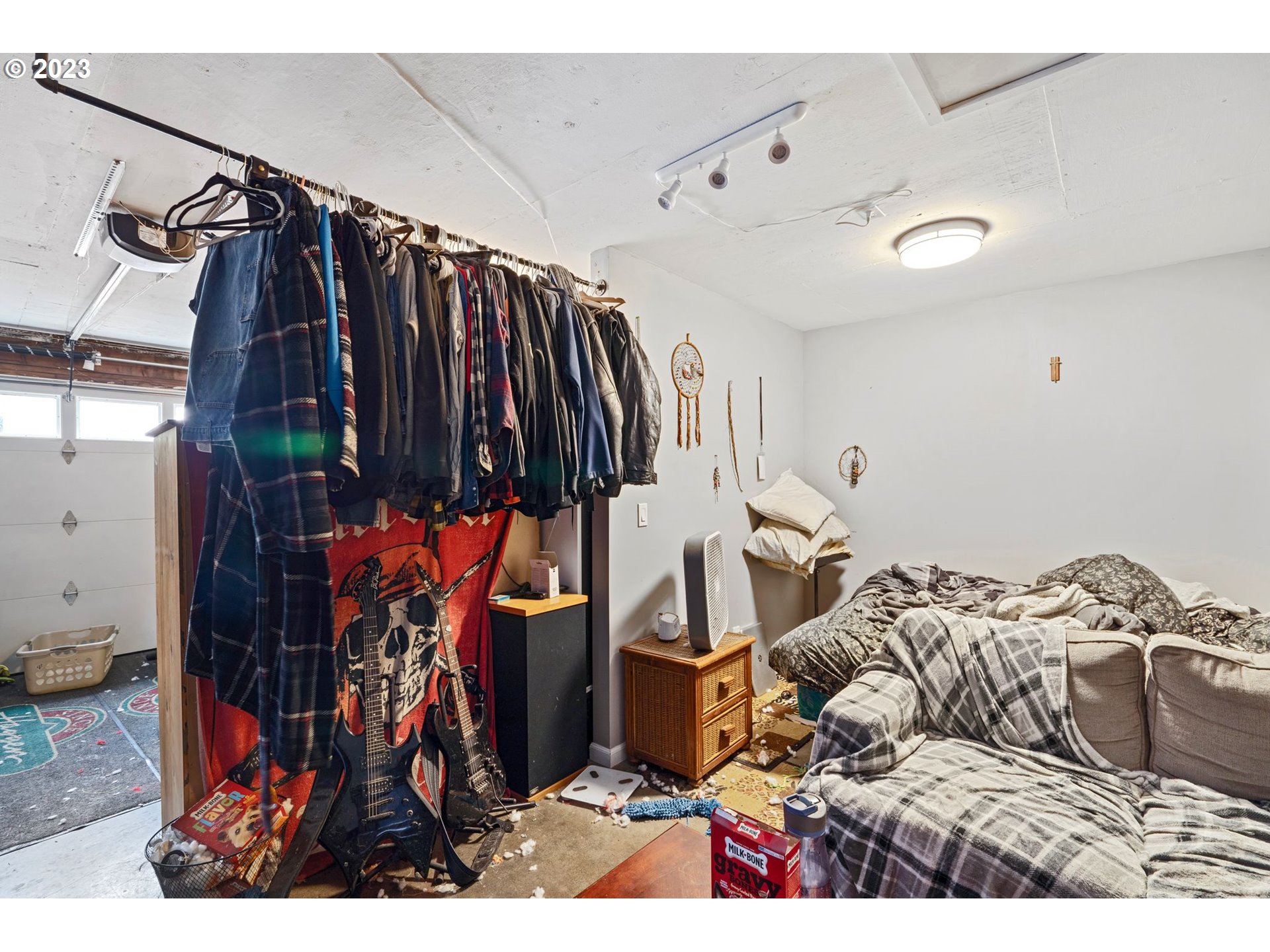 5119 Southeast 68th Avenue Portland, OR 97206 - Photo 27 of 43 a view of walk in closet with clothes and shoes