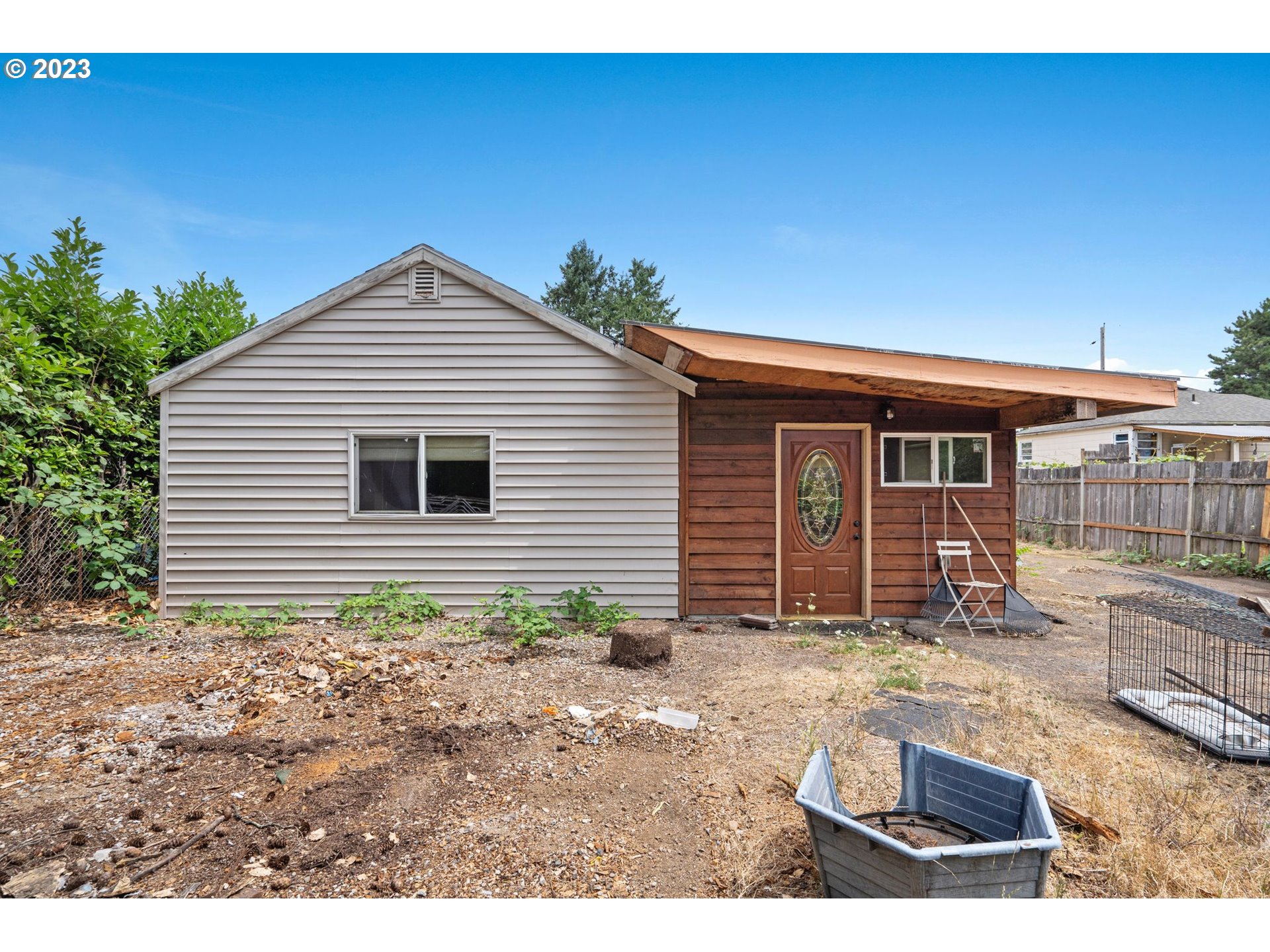 5119 Southeast 68th Avenue Portland, OR 97206 - Photo 30 of 43 a backyard of a house with yard barbeque oven and outdoor seating