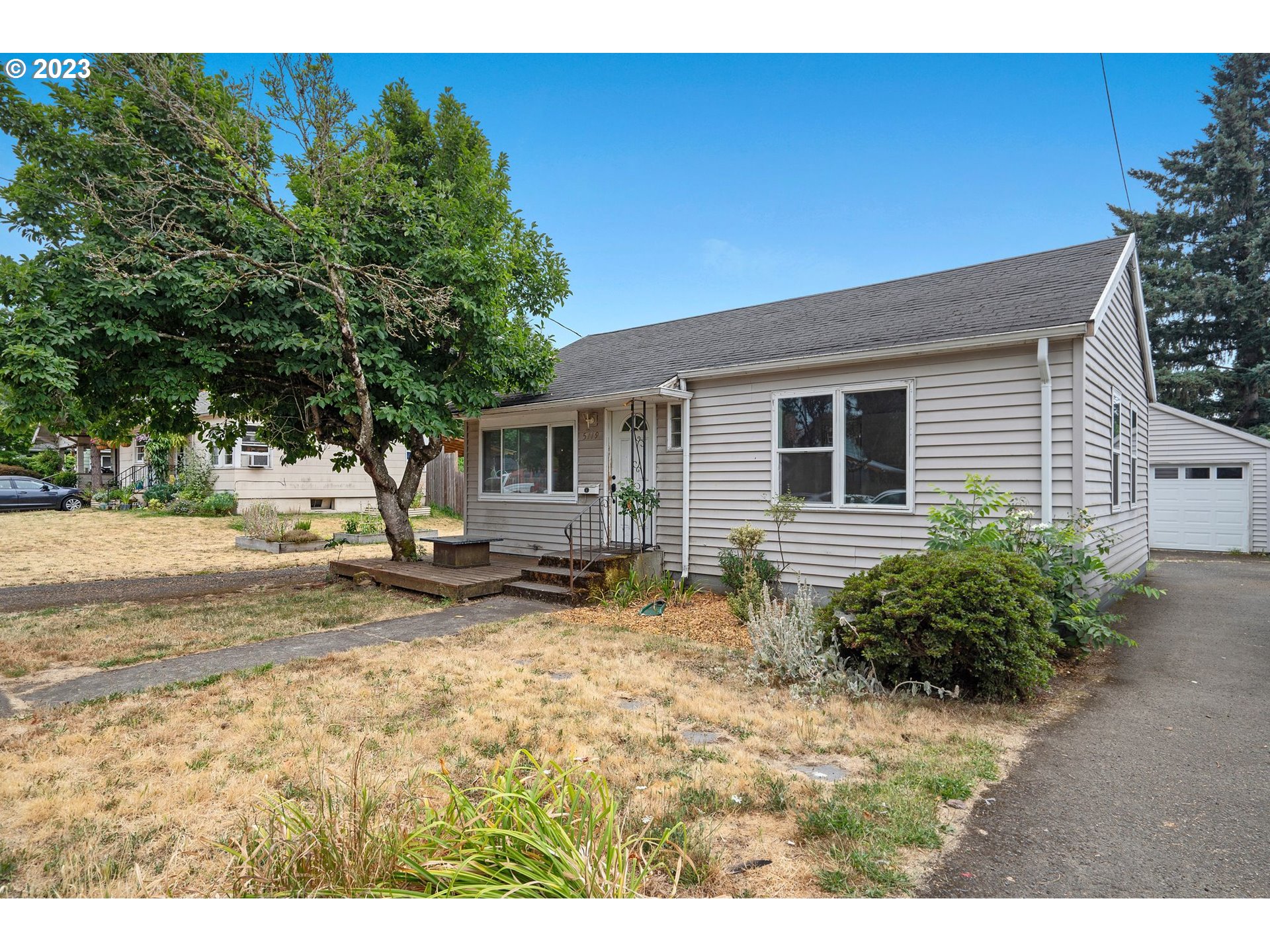 5119 Southeast 68th Avenue Portland, OR 97206 - Photo 3 of 43 a view of a house with a patio
