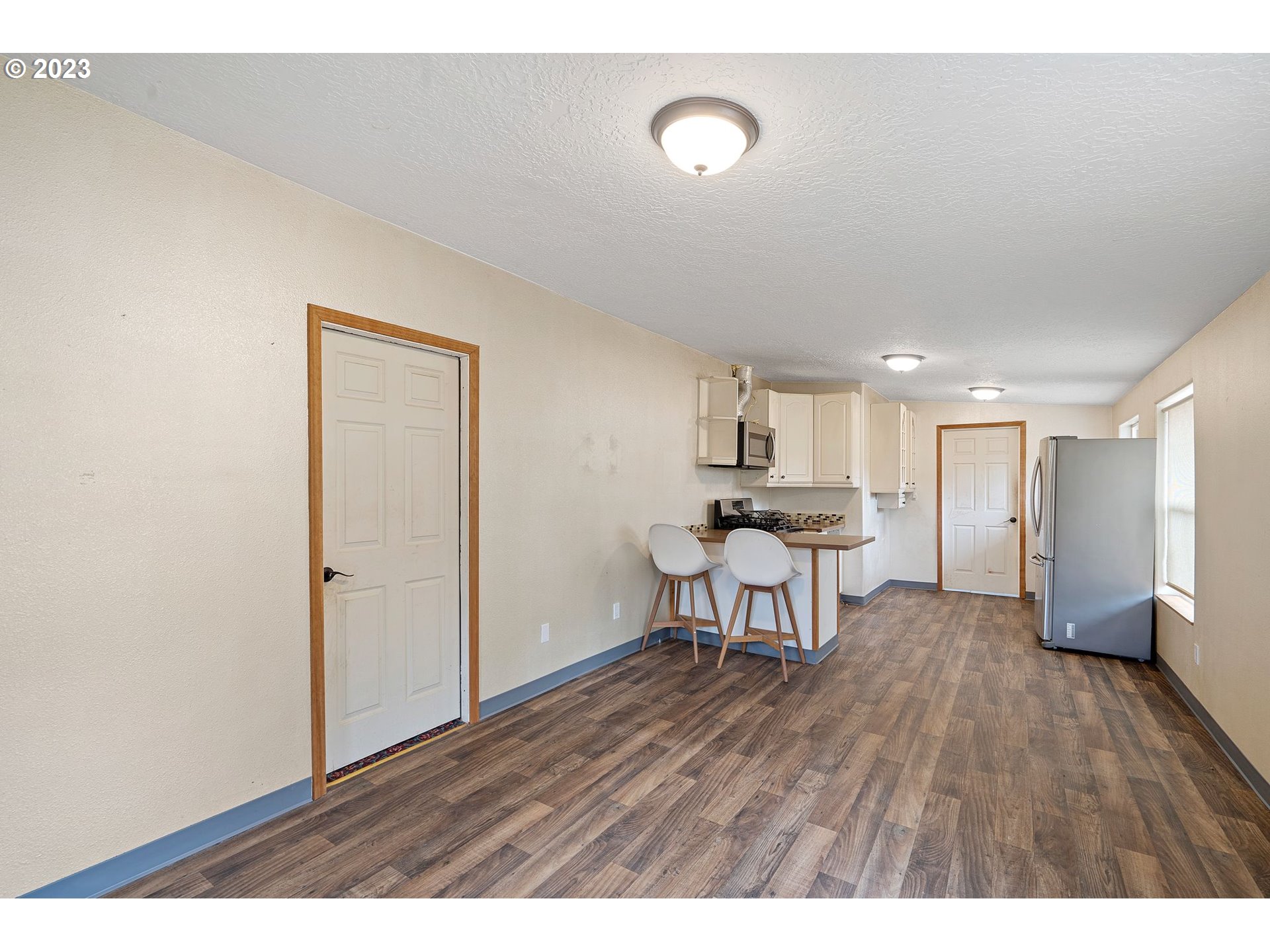 5119 Southeast 68th Avenue Portland, OR 97206 - Photo 33 of 43 a living room with furniture and a wooden floor