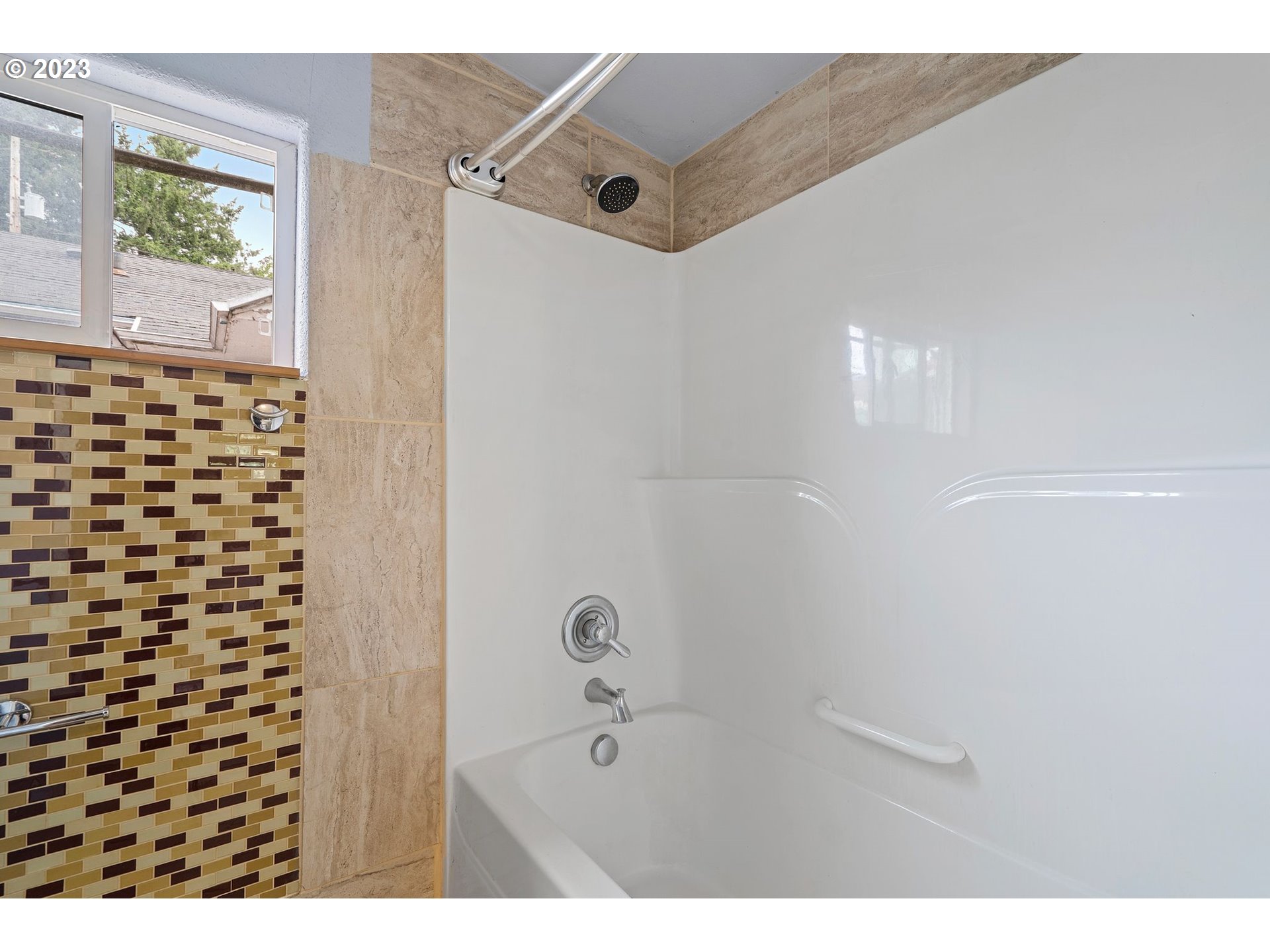 5119 Southeast 68th Avenue Portland, OR 97206 - Photo 38 of 43 a bathroom with a bathtub and a shower