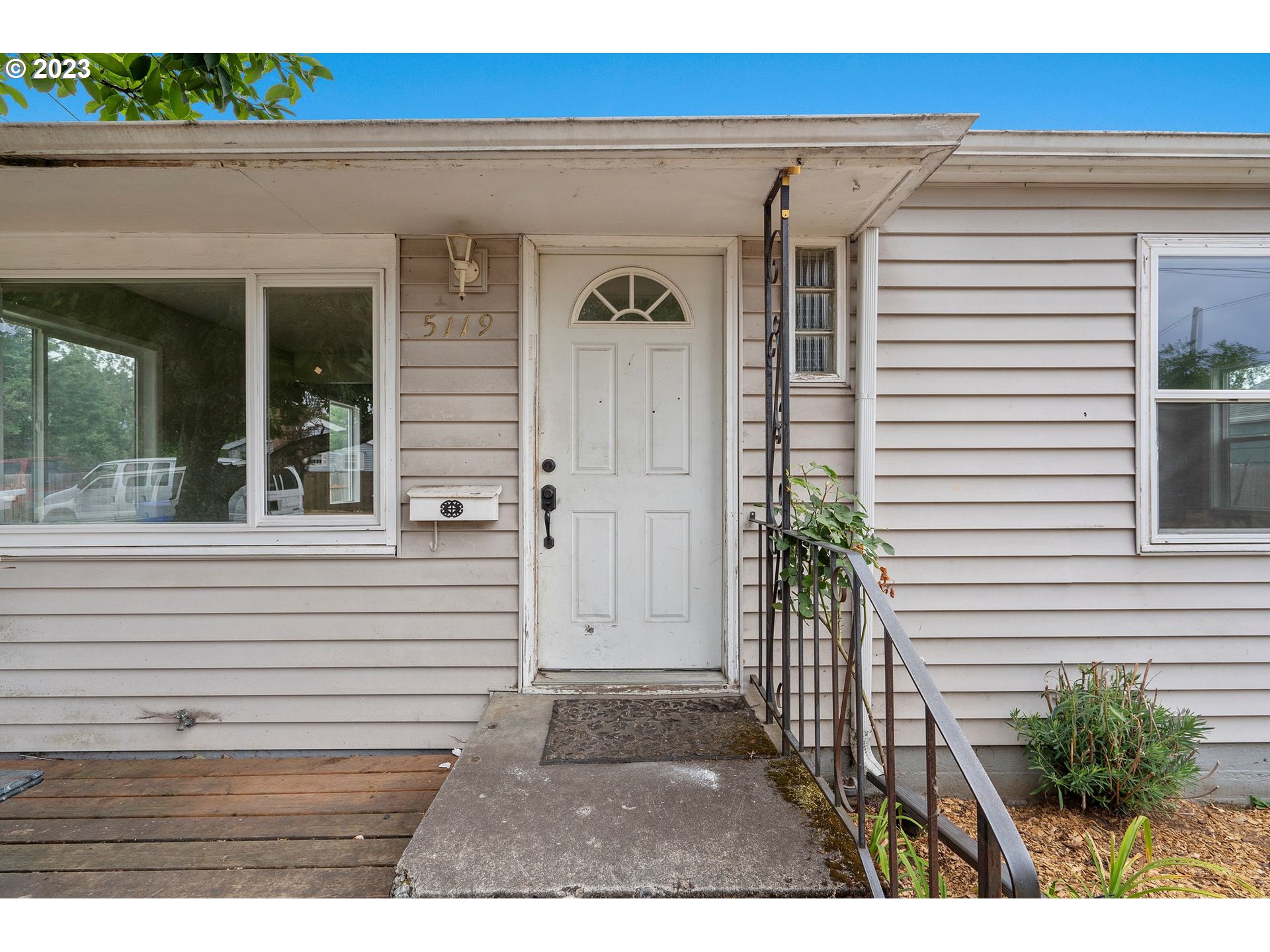 5119 Southeast 68th Avenue Portland, OR 97206 - Photo 4 of 43 a view of a door and a window