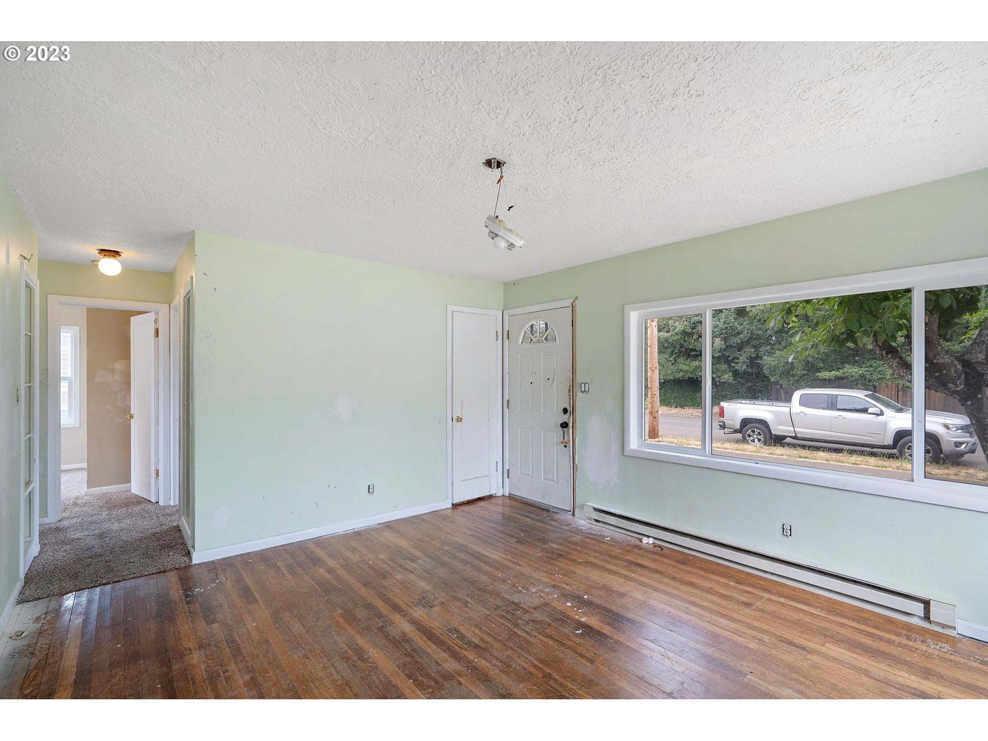 5119 Southeast 68th Avenue Portland, OR 97206 - Photo 6 of 43 a view of an empty room with a window