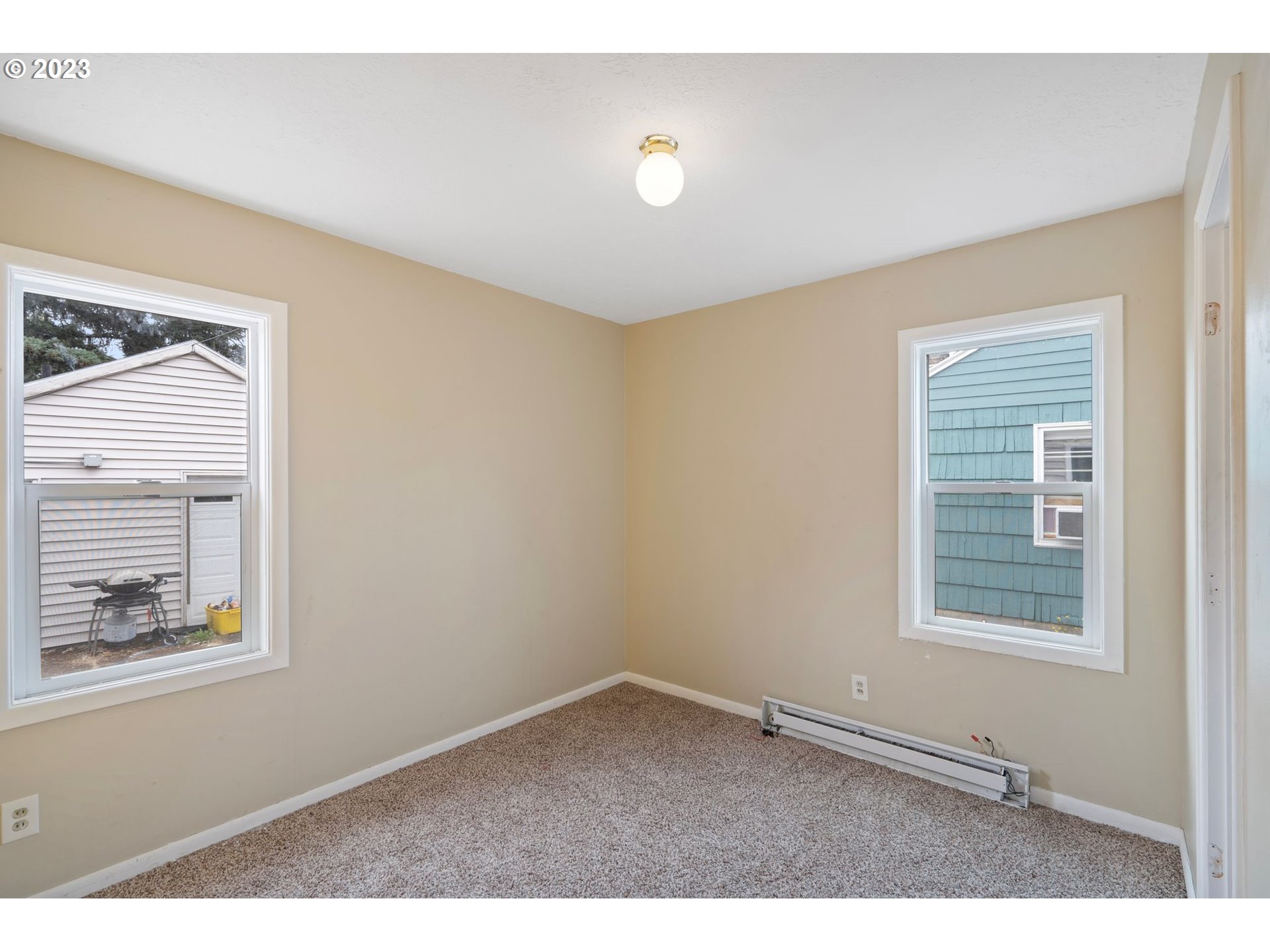 5119 Southeast 68th Avenue Portland, OR 97206 - Photo 9 of 43 a view of an empty room with a window
