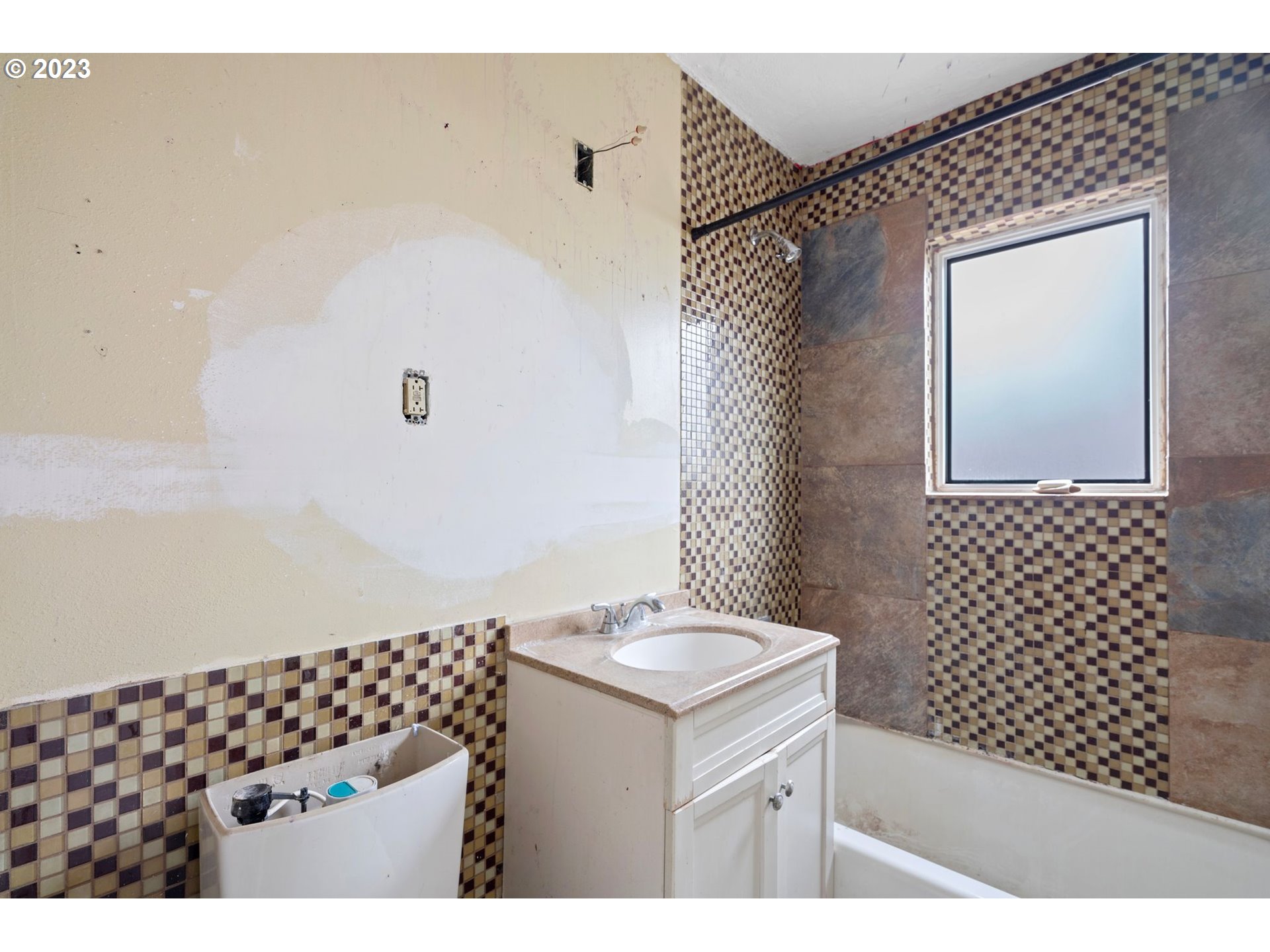 5119 Southeast 68th Avenue Portland, OR 97206 - Photo 10 of 43 a bathroom with a sink a vanity and a mirror
