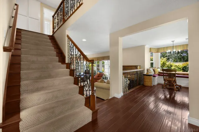 a view of entryway and livingroom with wooden floor