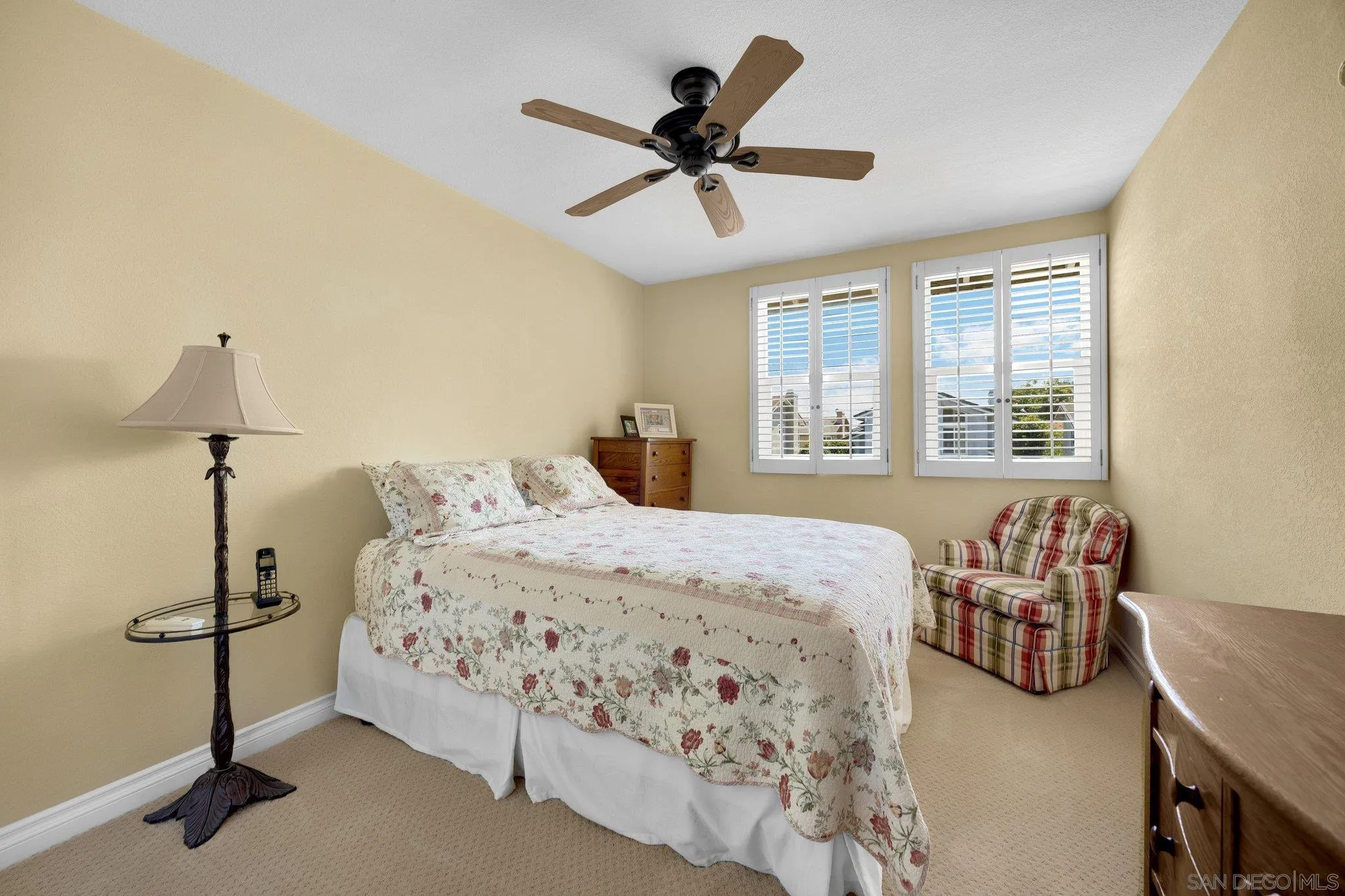 40 Brena Irvine, CA 92620 - Photo 18 of 39 a bedroom with a bed and a chandelier