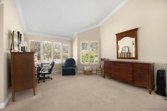 a bed room with furniture and a window