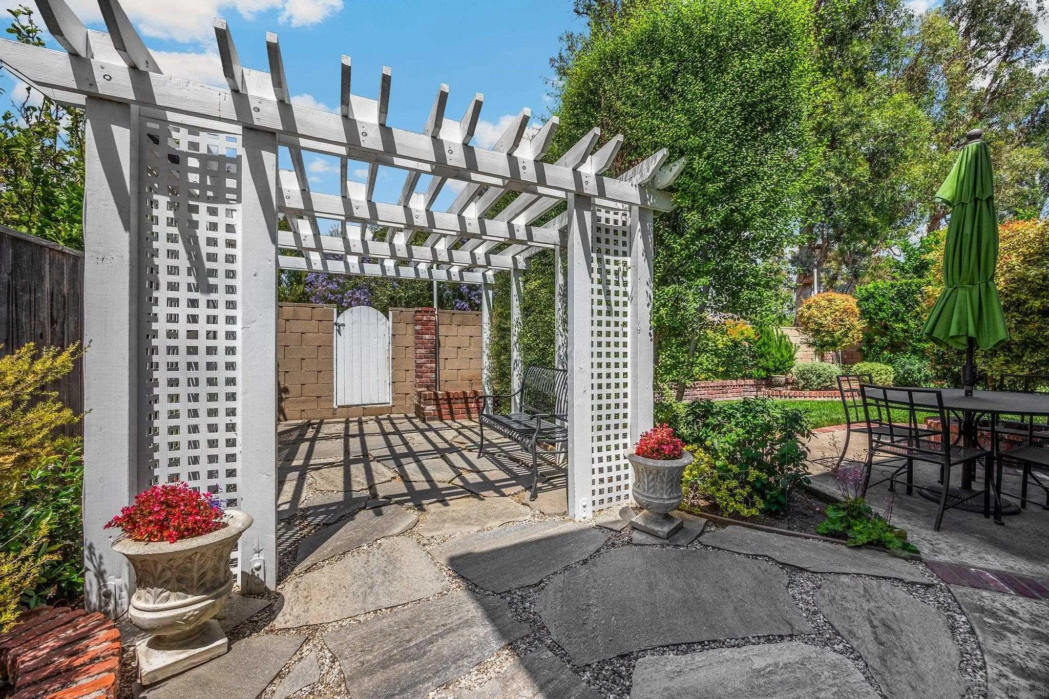40 Brena Irvine, CA 92620 - Photo 31 of 39 a view of a patio with table and chairs and potted plants