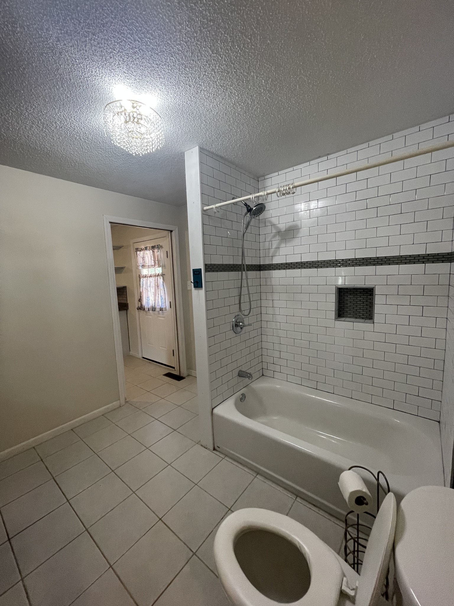 851 Akersville Road Lafayette, TN 37083 - Photo 18 of 29 a bathroom with a tub a toilet and a sink
