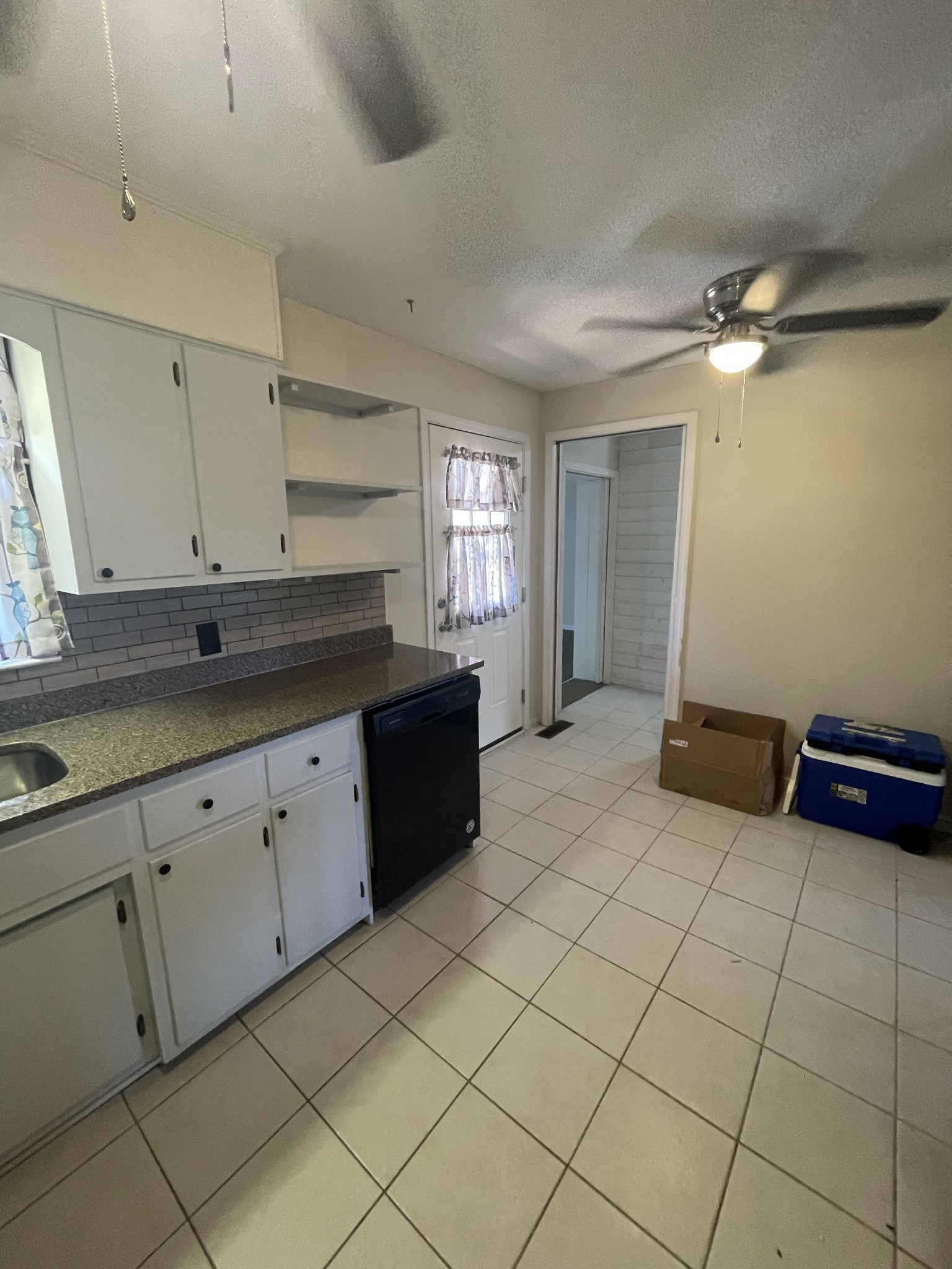 851 Akersville Road Lafayette, TN 37083 - Photo 19 of 29 a spacious bathroom with a granite countertop sink and a mirror