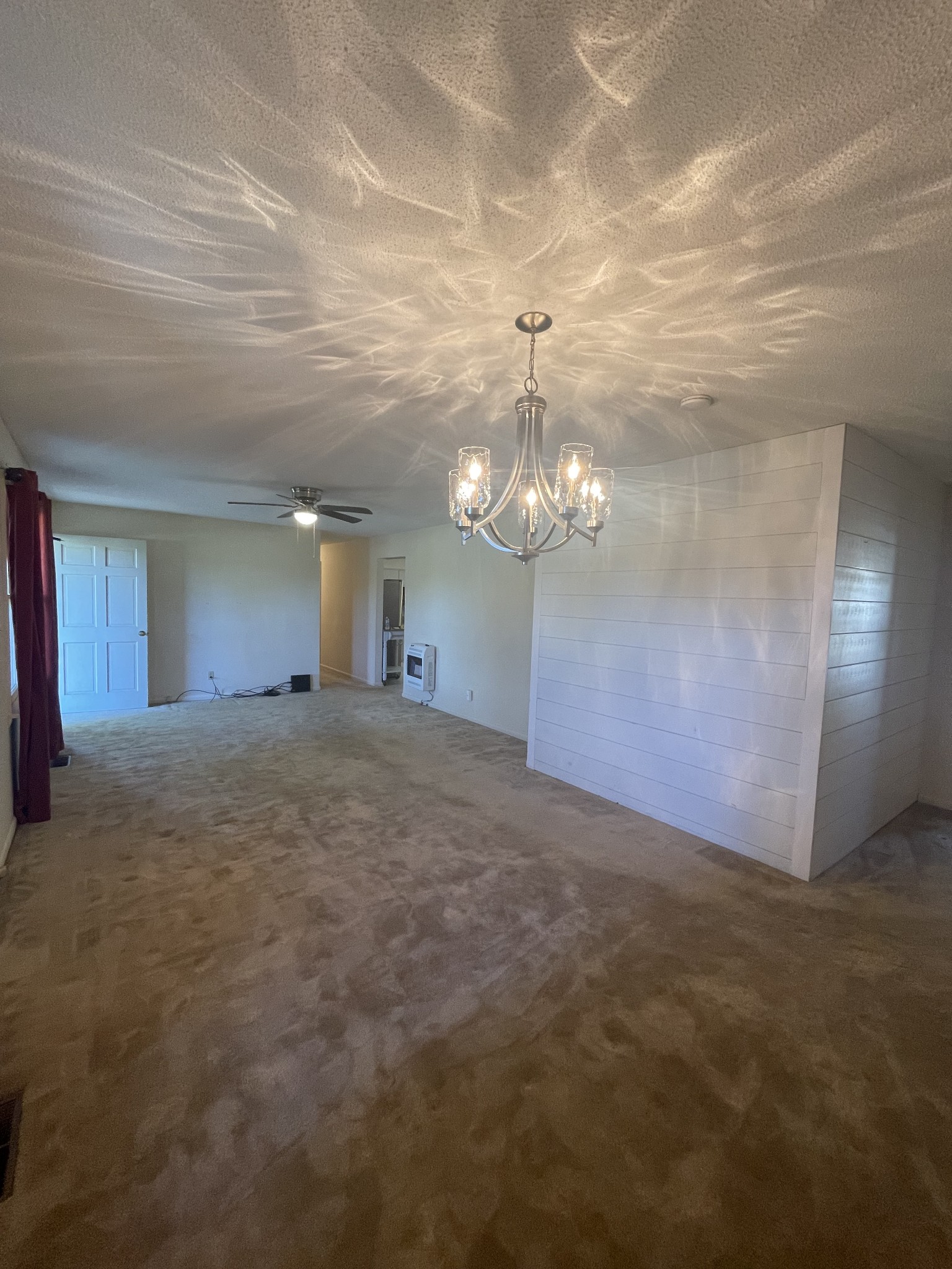 851 Akersville Road Lafayette, TN 37083 - Photo 26 of 29 a view of a livingroom with a chandelier fan
