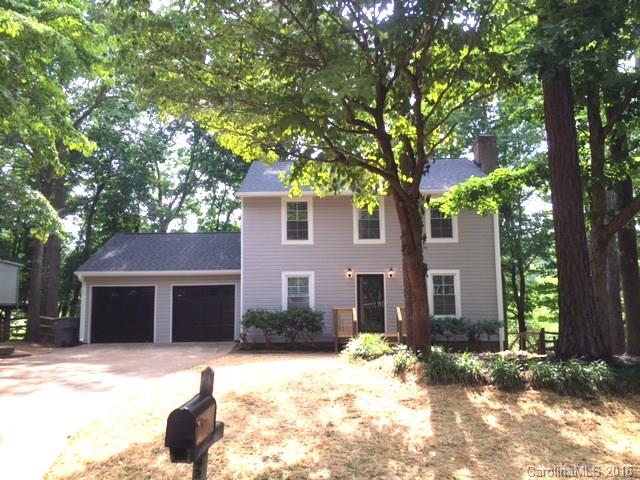 9242 Fairway Ridge Road Charlotte, NC 28277 - Photo 1 of 17 a front view of a house with a yard and garage