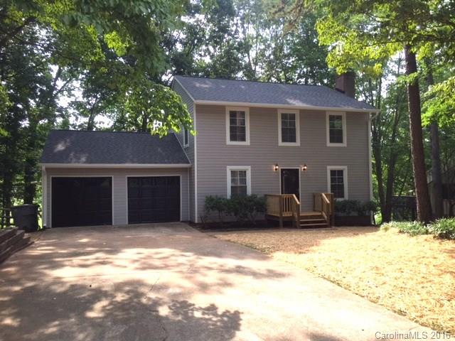 9242 Fairway Ridge Road Charlotte, NC 28277 - Photo 2 of 17 a front view of a house with a yard