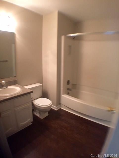9242 Fairway Ridge Road Charlotte, NC 28277 - Photo 12 of 17 a bathroom with a toilet a sink and bathtub