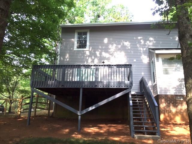9242 Fairway Ridge Road Charlotte, NC 28277 - Photo 15 of 17 a view of a wooden deck with a yard