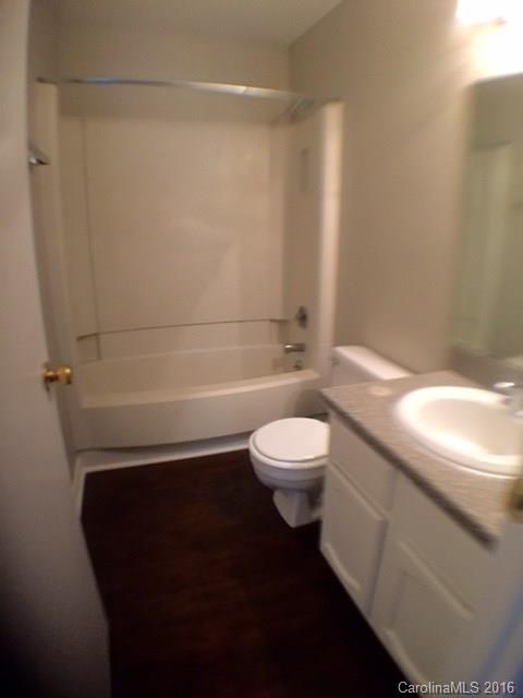 9242 Fairway Ridge Road Charlotte, NC 28277 - Photo 9 of 17 a bathroom with a toilet a sink and view