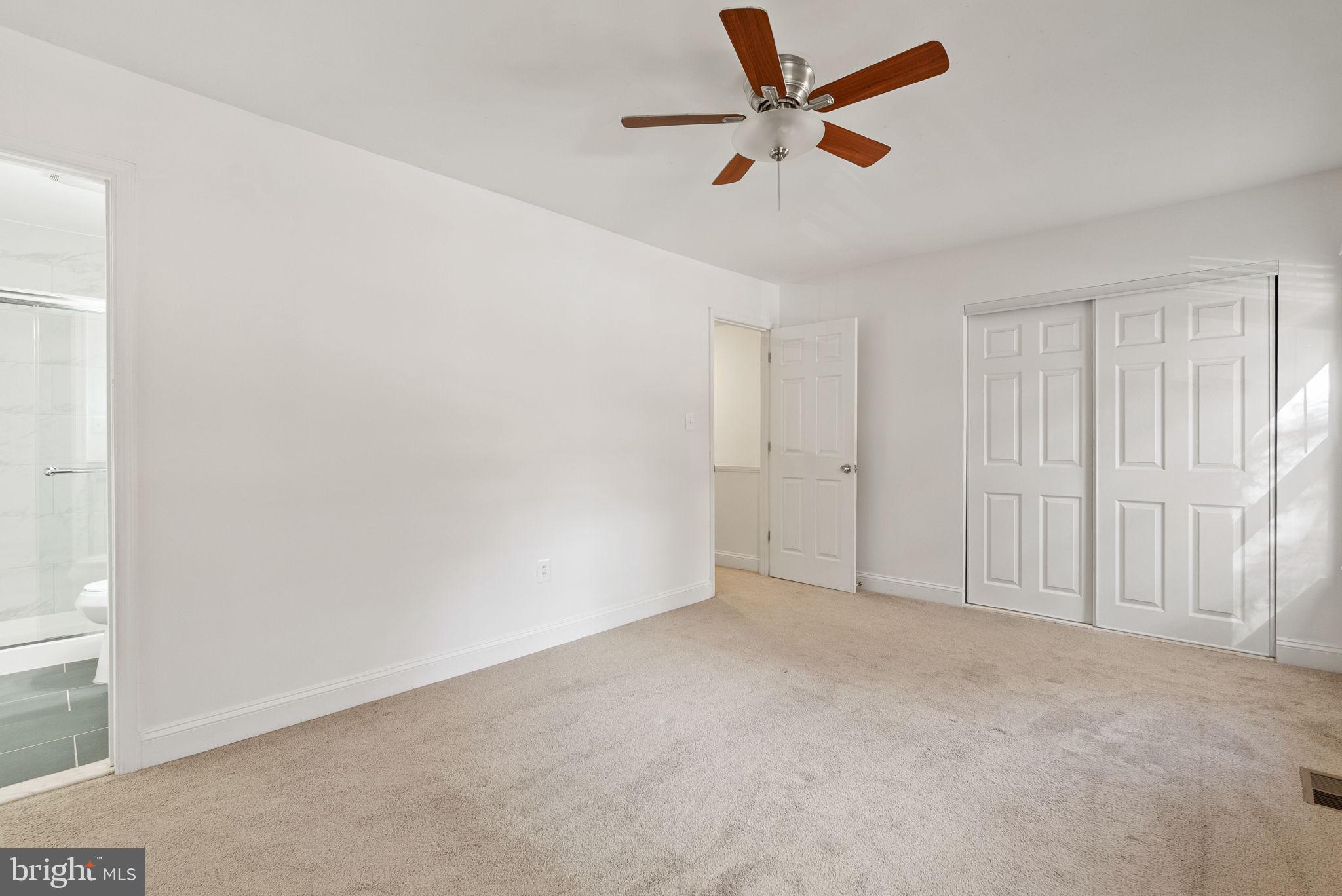 8914 Shamrock Court Springfield, VA 22152 - Photo 23 of 29 an empty room with a ceiling fan and window