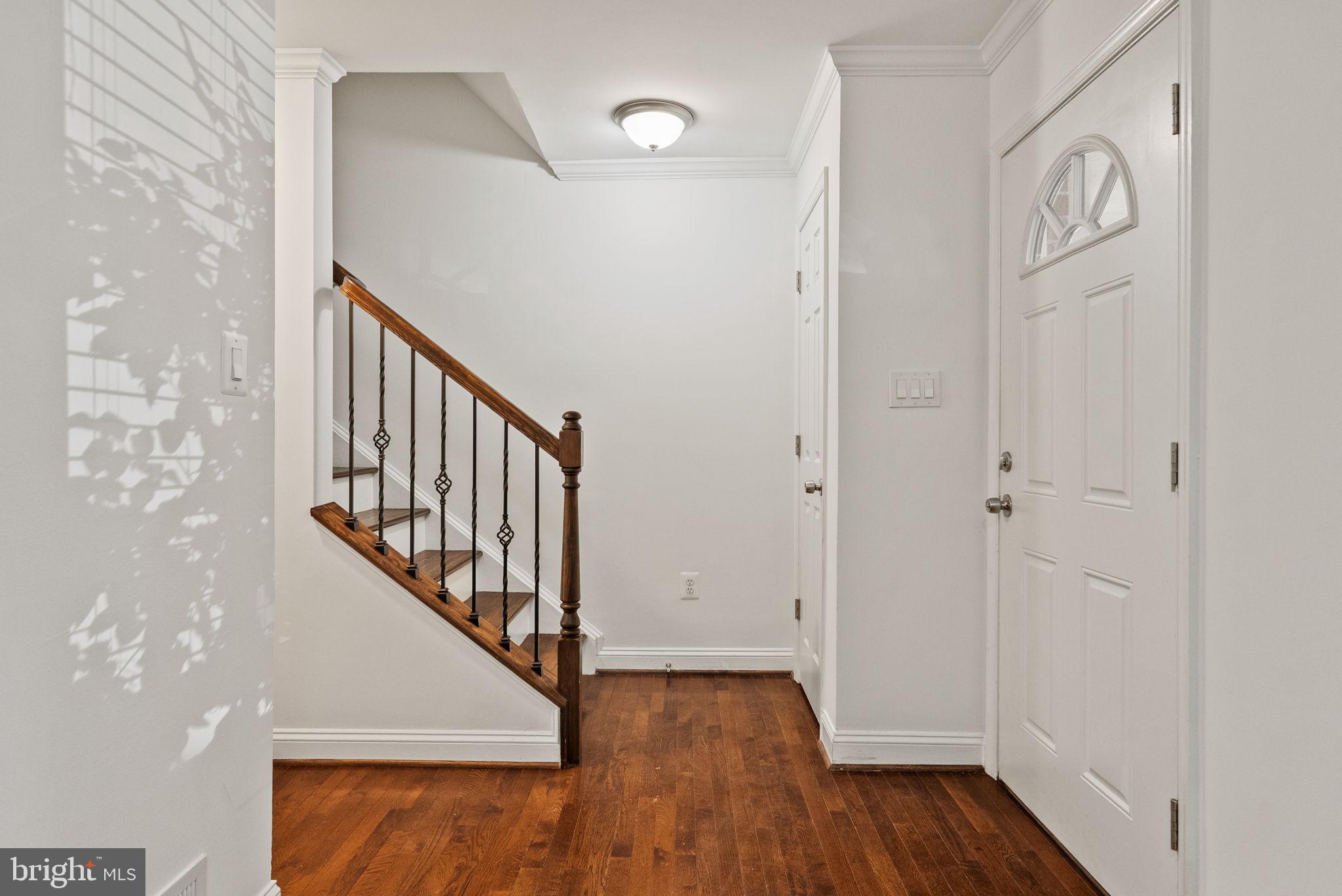 8914 Shamrock Court Springfield, VA 22152 - Photo 6 of 29 a view of a hallway with wooden floor and entryway