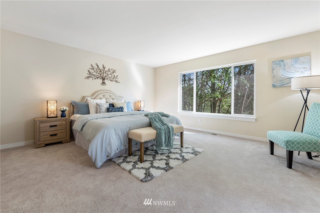 3915 167th Street Southeast Bothell, WA 98012 - Photo 14 of 28 a bedroom with a bed and a large window