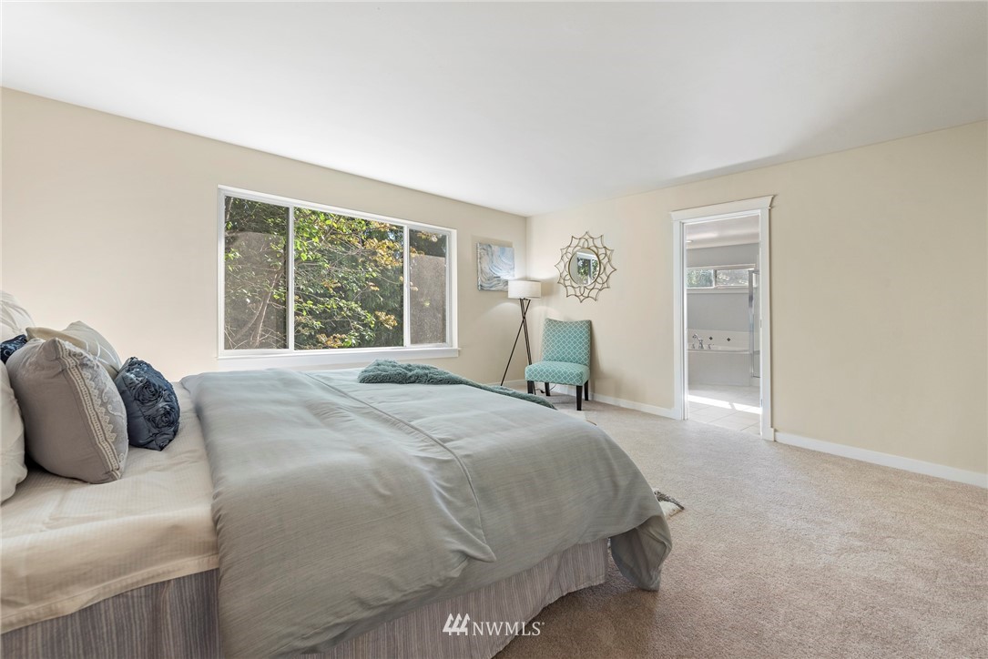 3915 167th Street Southeast Bothell, WA 98012 - Photo 15 of 28 a bedroom with a bed and a window