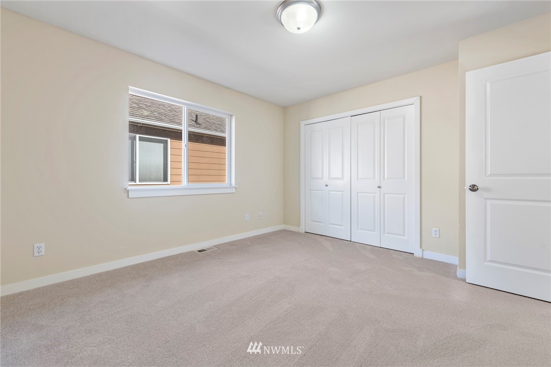 3915 167th Street Southeast Bothell, WA 98012 - Photo 19 of 28 an empty room with windows