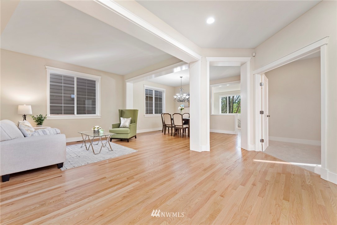 3915 167th Street Southeast Bothell, WA 98012 - Photo 4 of 28 a living room with furniture and wooden floor