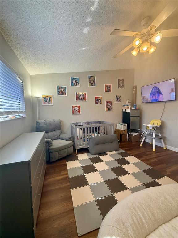 1920 Whitney Way Clearwater, FL 33760 - Photo 15 of 38 a spacious bedroom with a bed and a couch