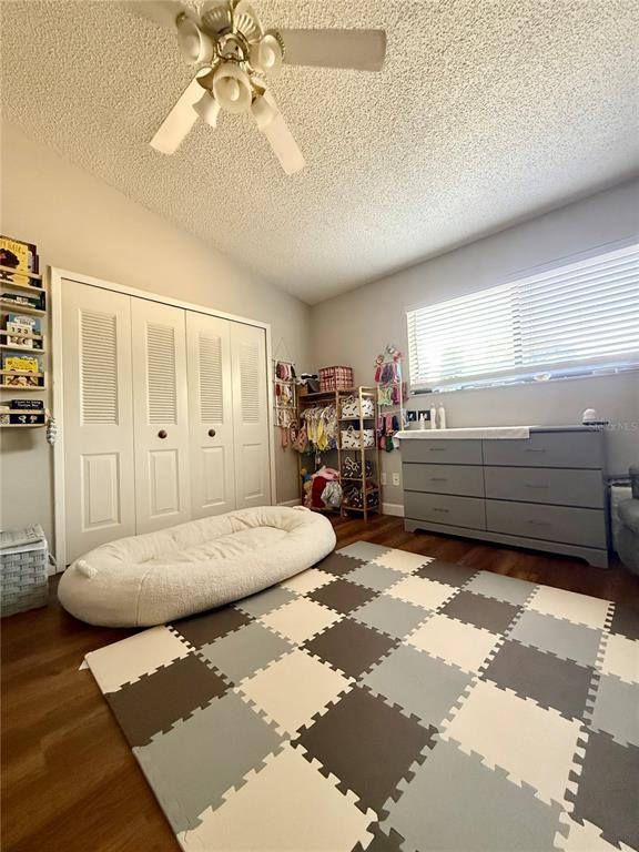 1920 Whitney Way Clearwater, FL 33760 - Photo 17 of 38 a bedroom with a bed and ceiling fan