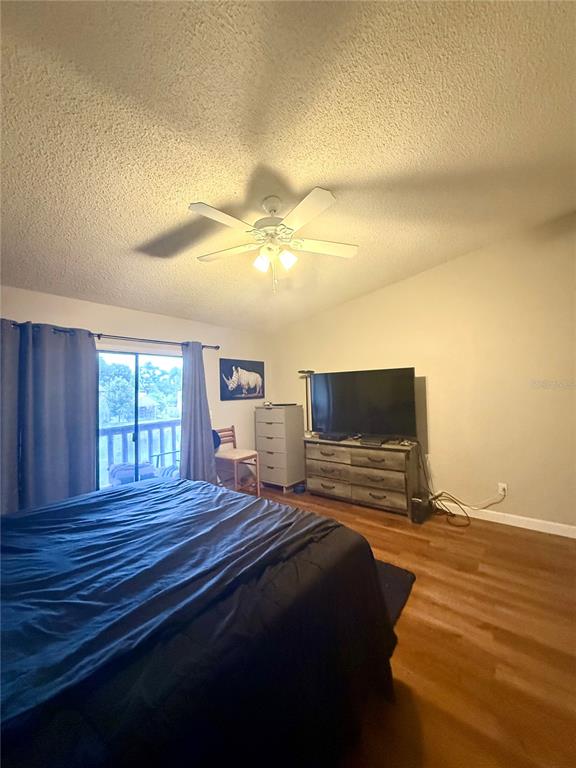 1920 Whitney Way Clearwater, FL 33760 - Photo 20 of 38 a bedroom with a bed and wooden floor