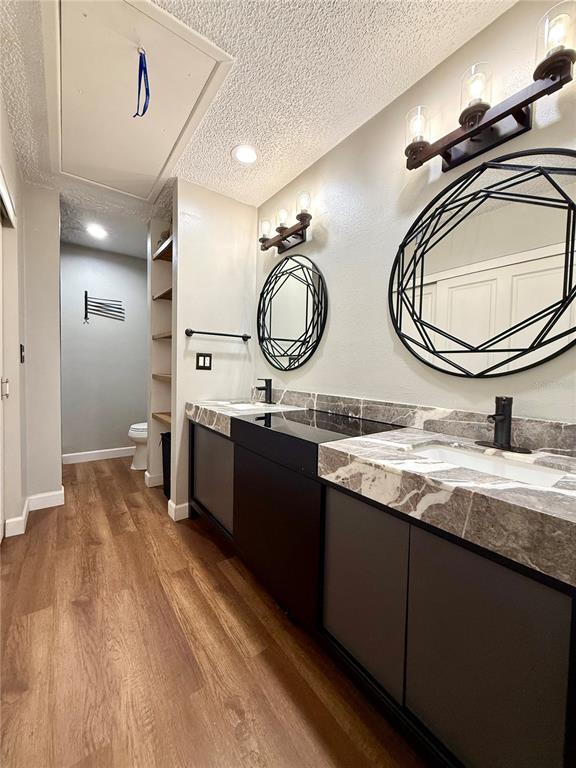 1920 Whitney Way Clearwater, FL 33760 - Photo 23 of 38 a bathroom with a double vanity sink and a mirror