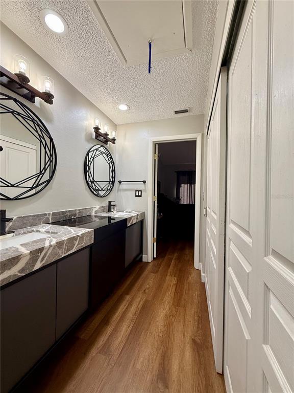 1920 Whitney Way Clearwater, FL 33760 - Photo 24 of 38 a large bathroom with a double vanity sink and a mirror