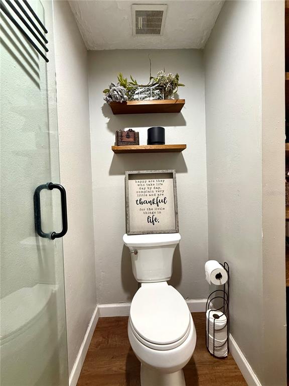 1920 Whitney Way Clearwater, FL 33760 - Photo 25 of 38 a bathroom with a toilet and a sink