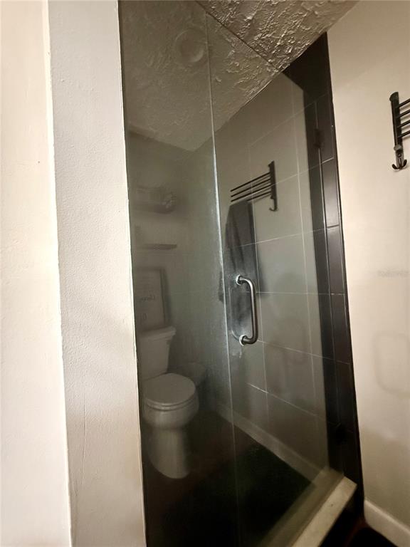 1920 Whitney Way Clearwater, FL 33760 - Photo 26 of 38 a bathroom with a shower and toilet