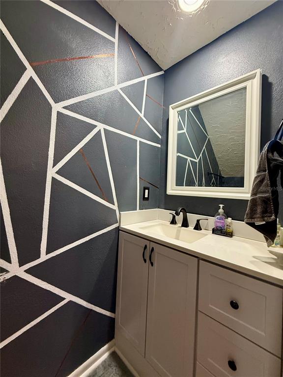 1920 Whitney Way Clearwater, FL 33760 - Photo 28 of 38 a bathroom with a sink and a mirror