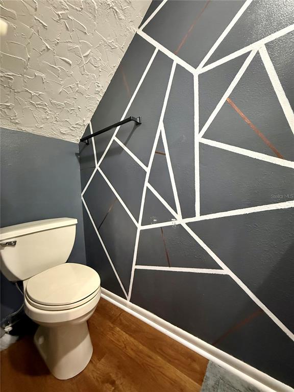 1920 Whitney Way Clearwater, FL 33760 - Photo 29 of 38 a white toilet sitting next to a small tub