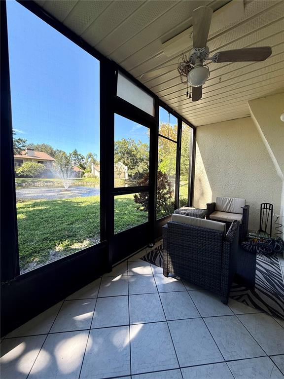 1920 Whitney Way Clearwater, FL 33760 - Photo 30 of 38 a room with a large pool table and large windows