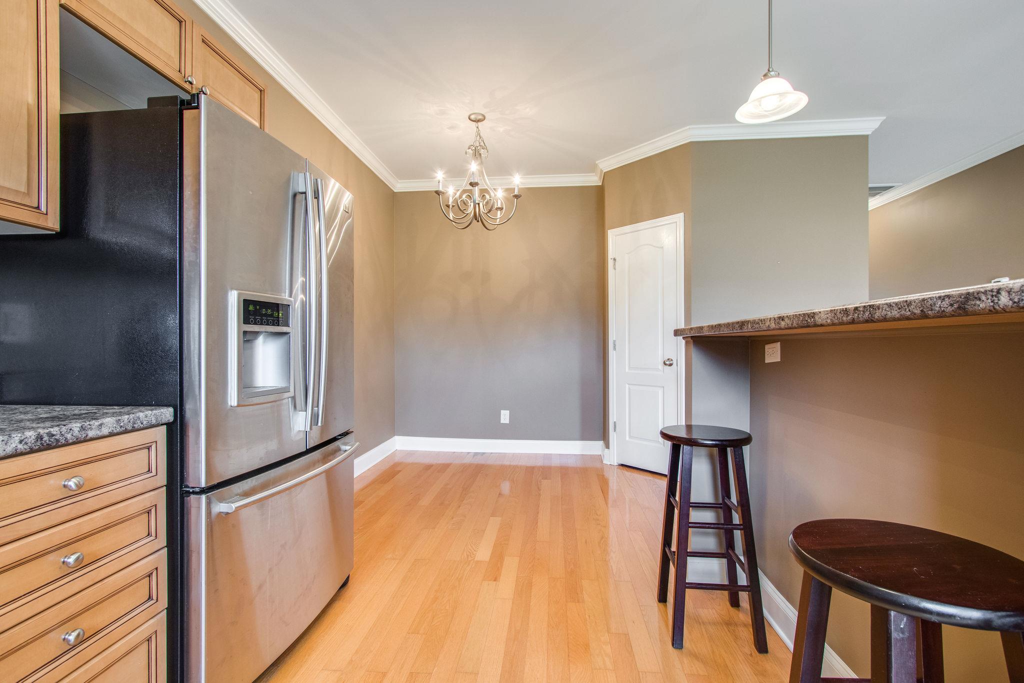735 Tulip Grove Road, Unit 237 Hermitage, TN 37076 - Photo 13 of 29 a view of a livingroom with a furniture wooden floor and staircase
