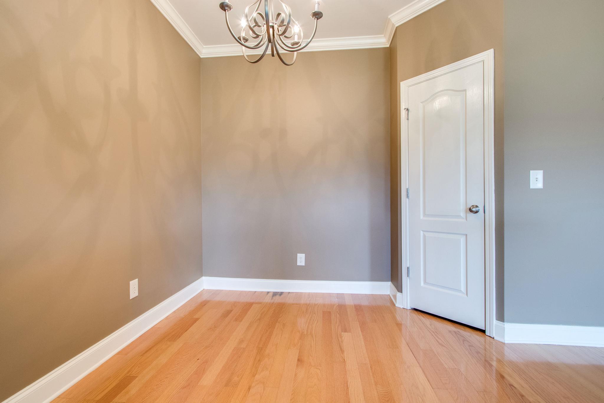 735 Tulip Grove Road, Unit 237 Hermitage, TN 37076 - Photo 14 of 29 a view of a room with wooden floor and a chandelier