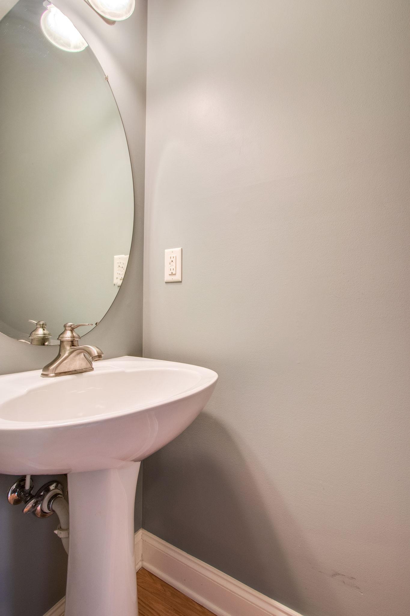 735 Tulip Grove Road, Unit 237 Hermitage, TN 37076 - Photo 15 of 29 a bathroom with a sink and a mirror