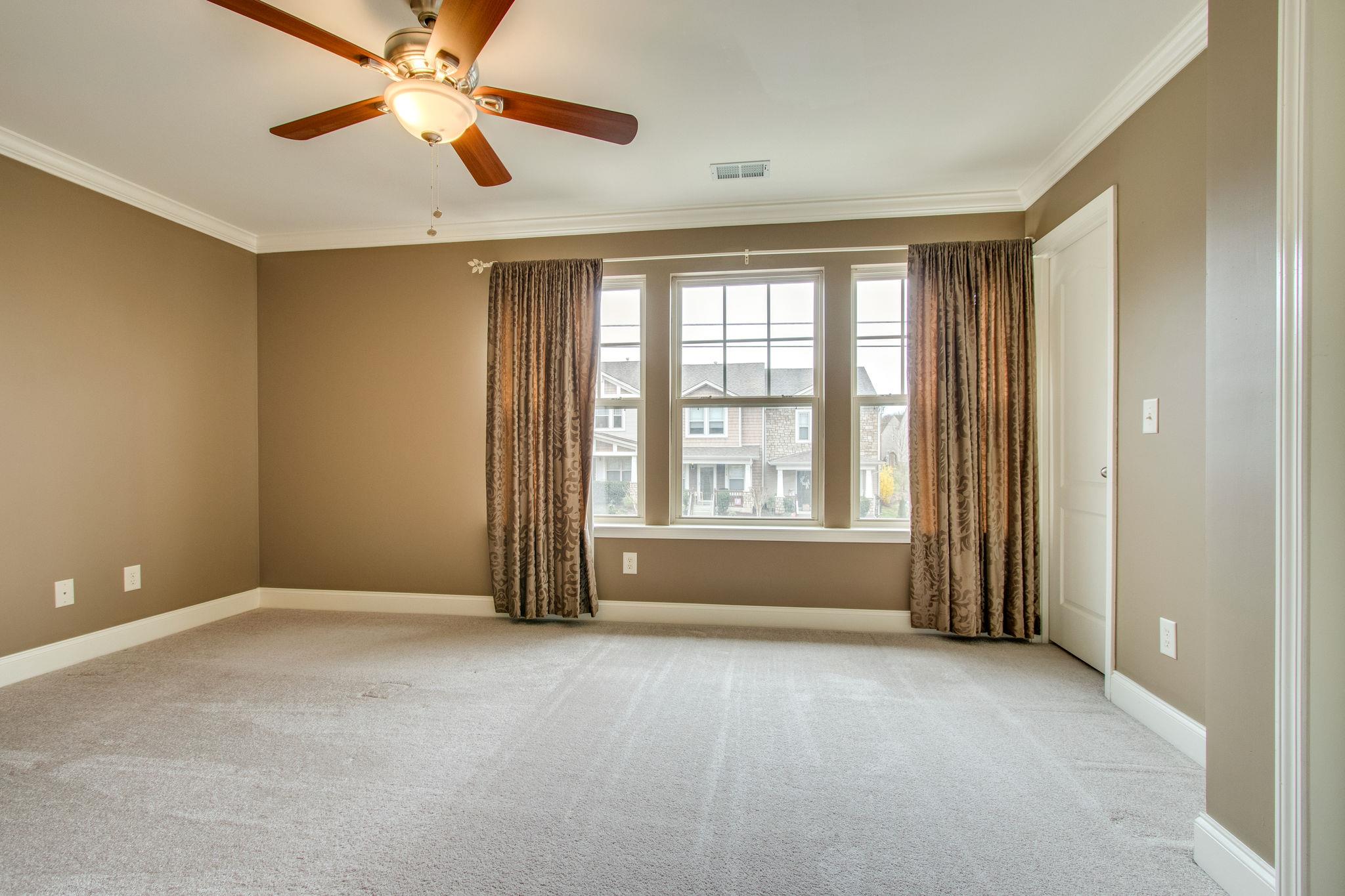735 Tulip Grove Road, Unit 237 Hermitage, TN 37076 - Photo 17 of 29 an empty room with windows and fan