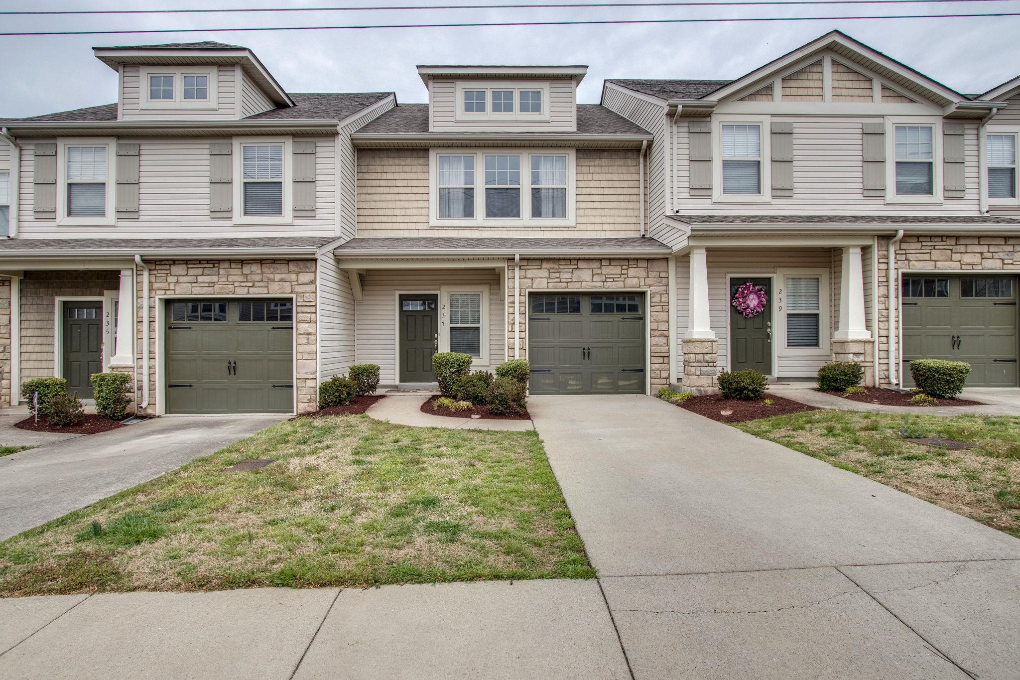 735 Tulip Grove Road, Unit 237 Hermitage, TN 37076 - Photo 2 of 29 a front view of a house with yard