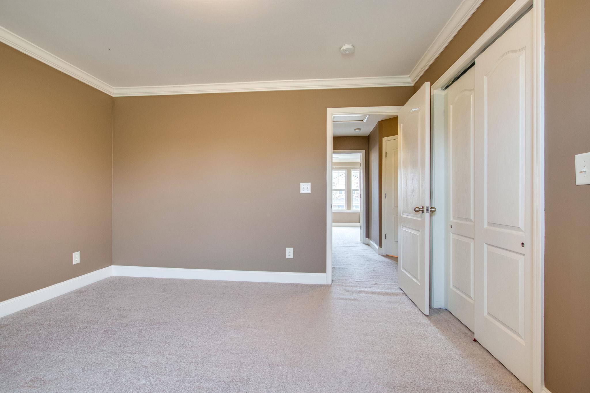 735 Tulip Grove Road, Unit 237 Hermitage, TN 37076 - Photo 24 of 29 a view of a hallway with wooden floor and closet area