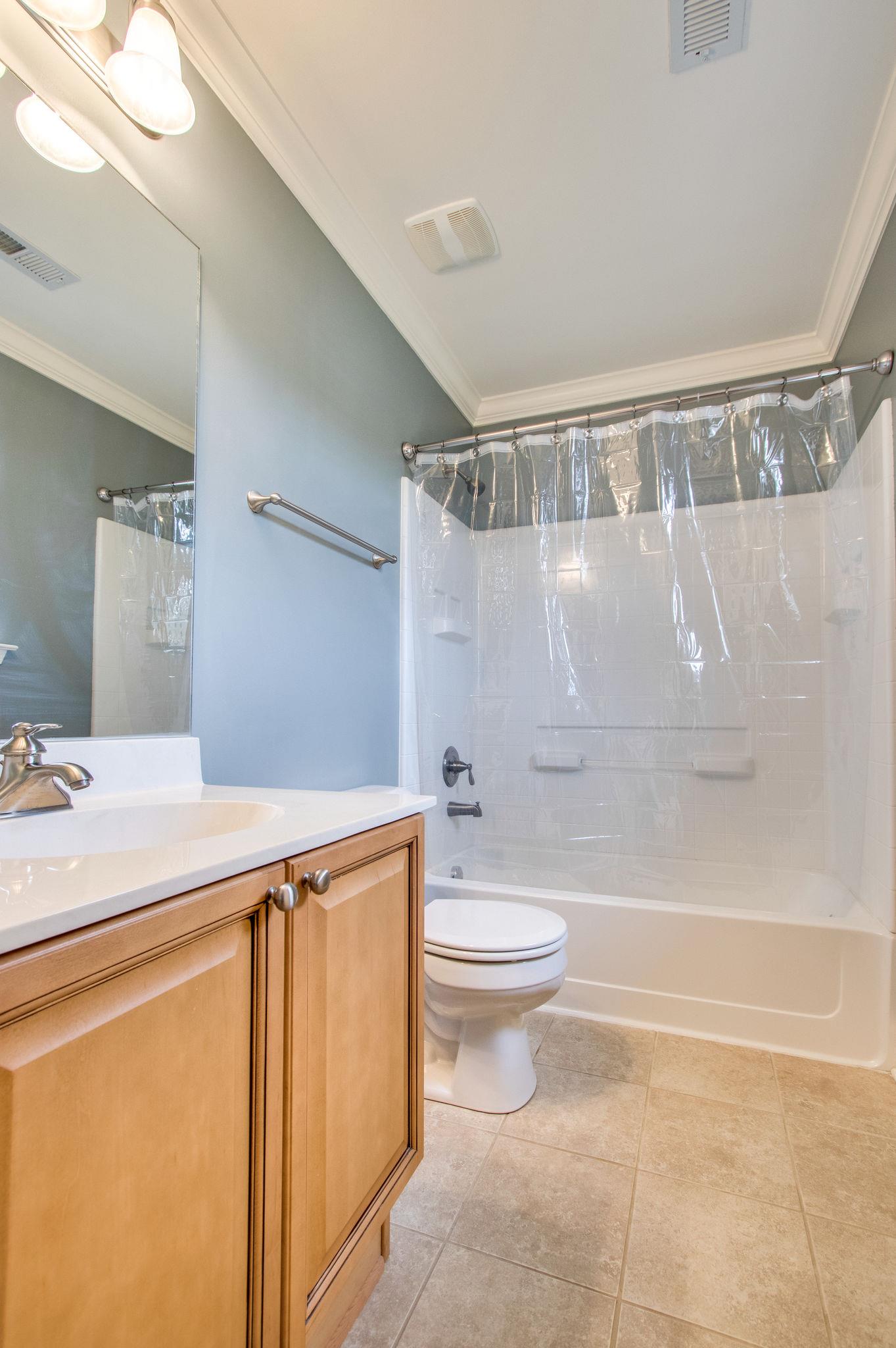 735 Tulip Grove Road, Unit 237 Hermitage, TN 37076 - Photo 25 of 29 a bathroom with a sink a toilet and a bathtub