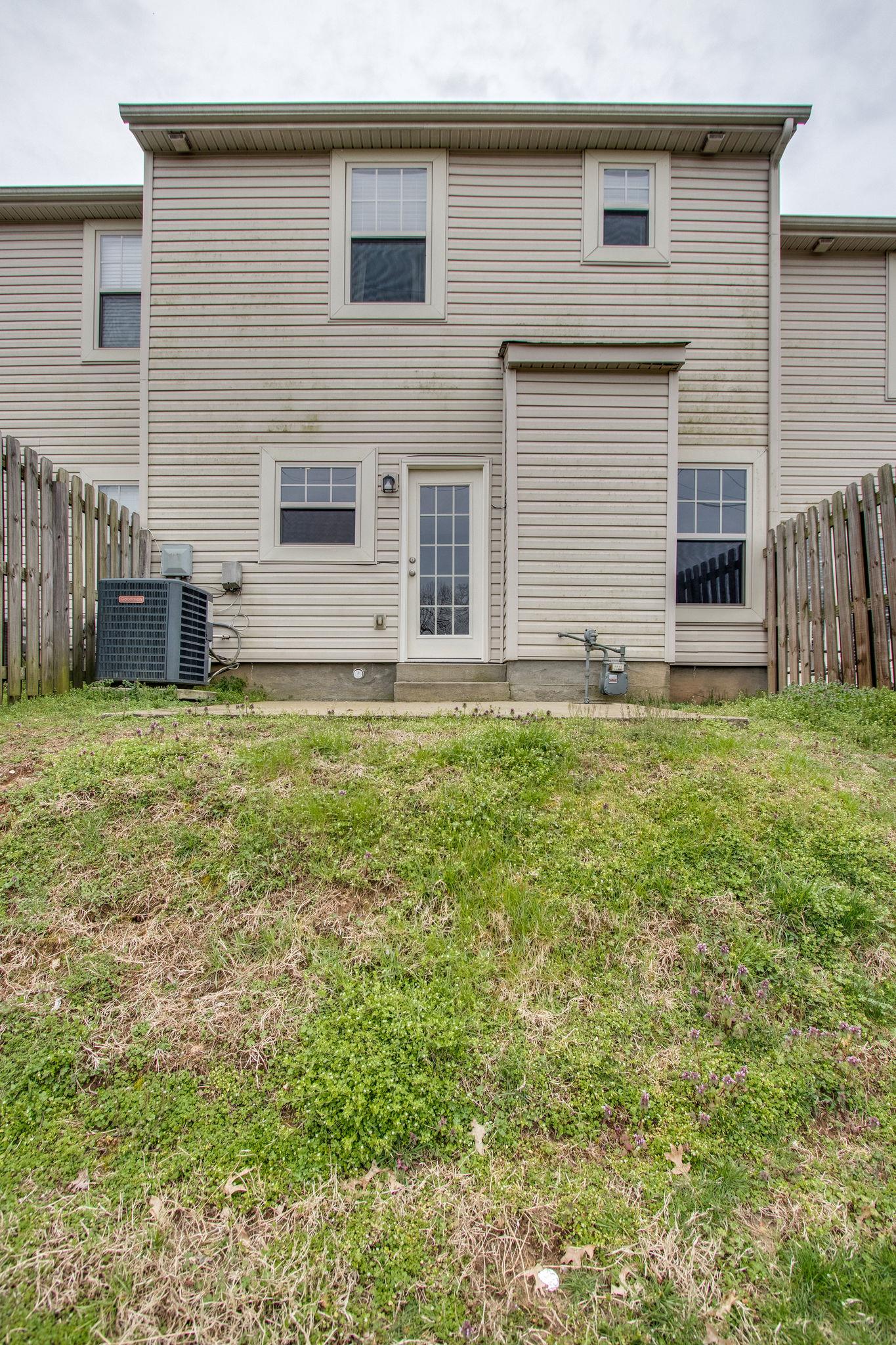 735 Tulip Grove Road, Unit 237 Hermitage, TN 37076 - Photo 28 of 29 a house that has a big yard in front of it