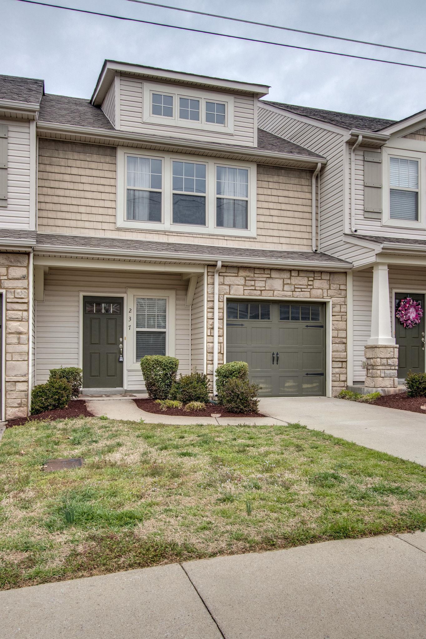 735 Tulip Grove Road, Unit 237 Hermitage, TN 37076 - Photo 3 of 29 front view of a house with a yard