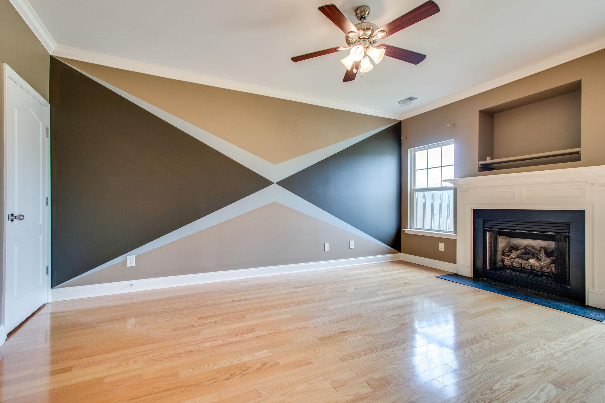 735 Tulip Grove Road, Unit 237 Hermitage, TN 37076 - Photo 8 of 29 a view of an empty room with a fireplace