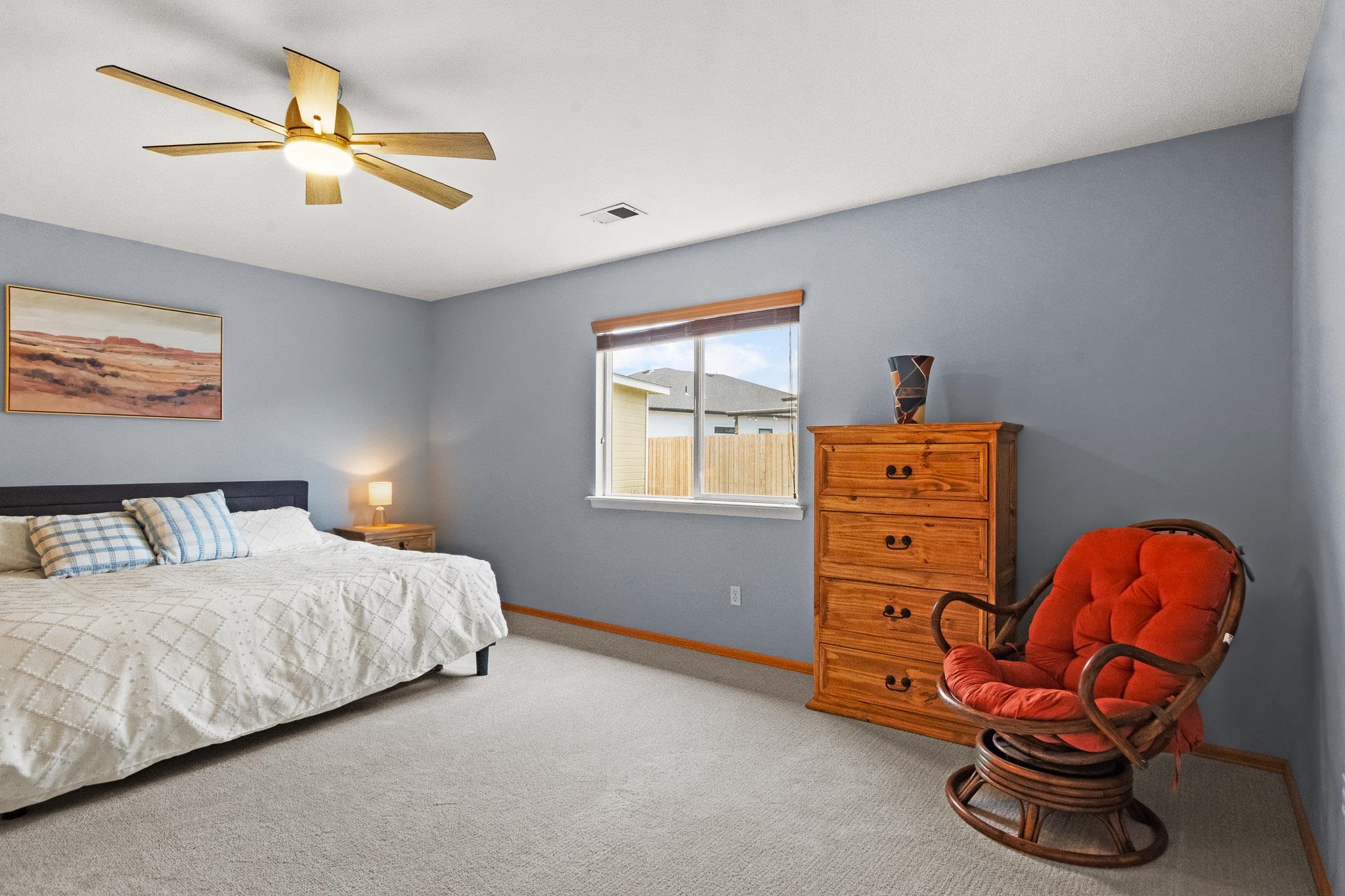 912 Kaley Street Fruita, CO 81521 - Photo 4 of 32 a bedroom with a bed and window